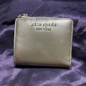 Gold Kate spade folded wallet in good condition